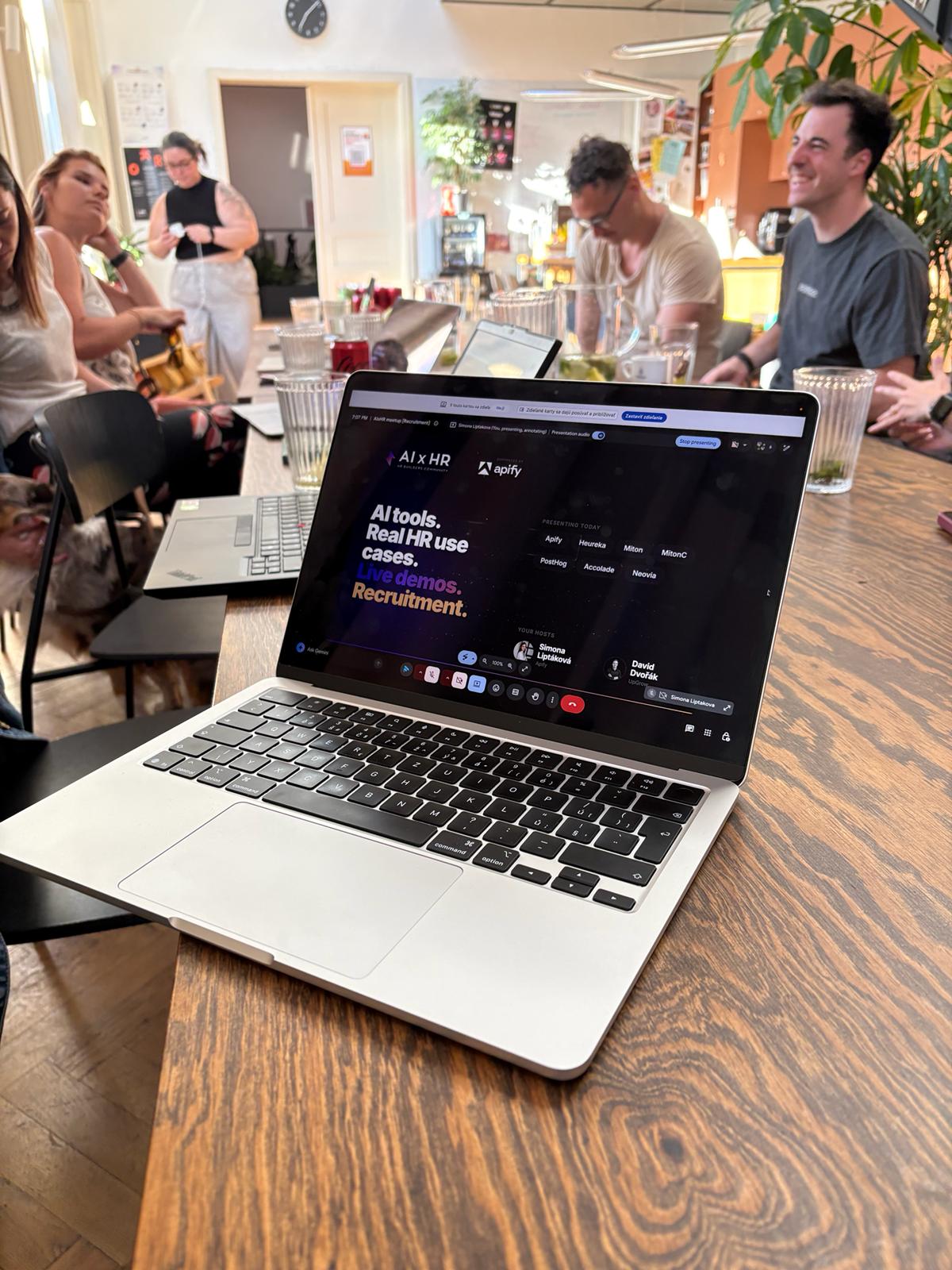Past AI x HR session — builder showing their tool on a laptop